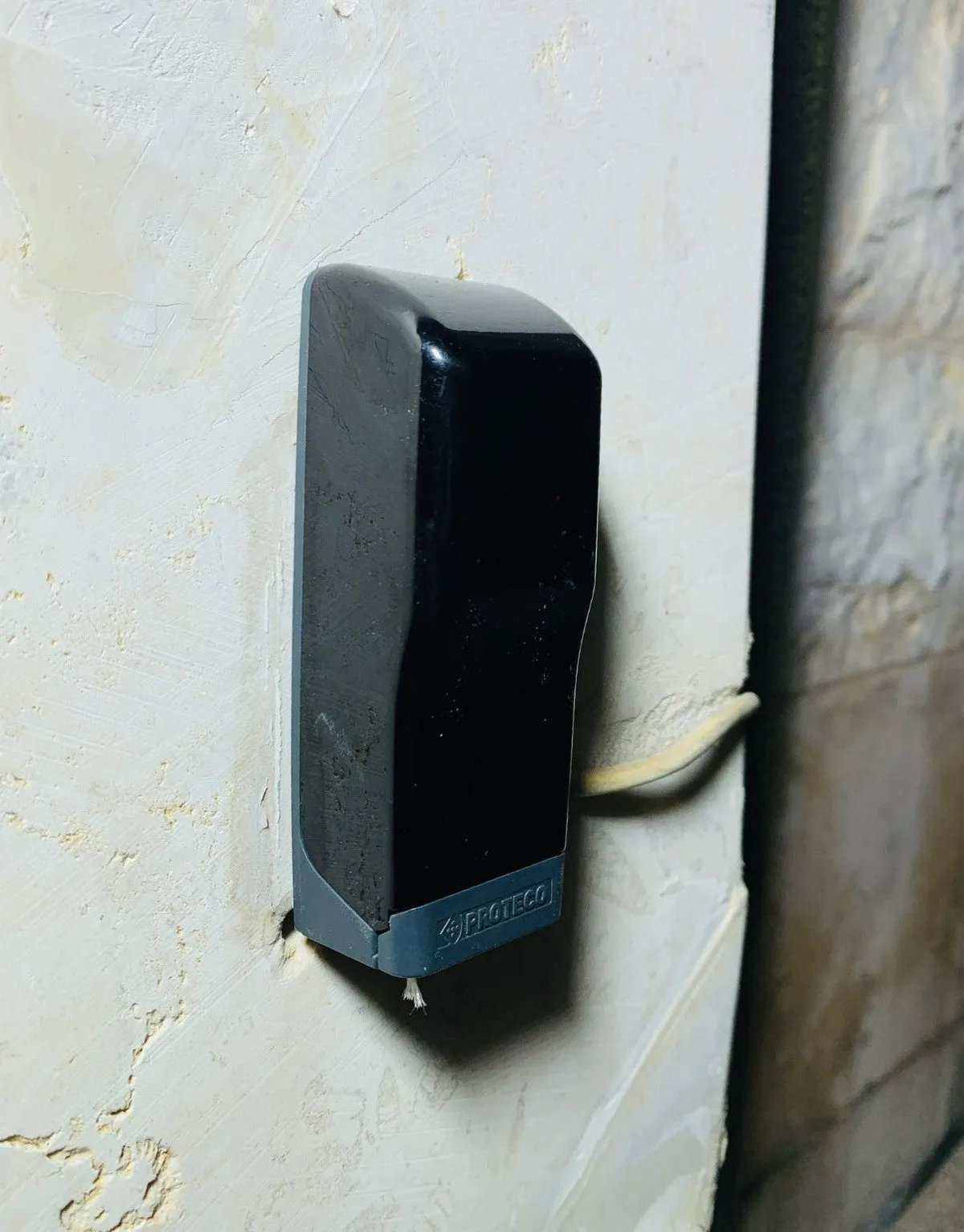 Gate safety sensor for Proteco ASTER 4 NEW, with a black and grey plastic rectangular housing and visible cable