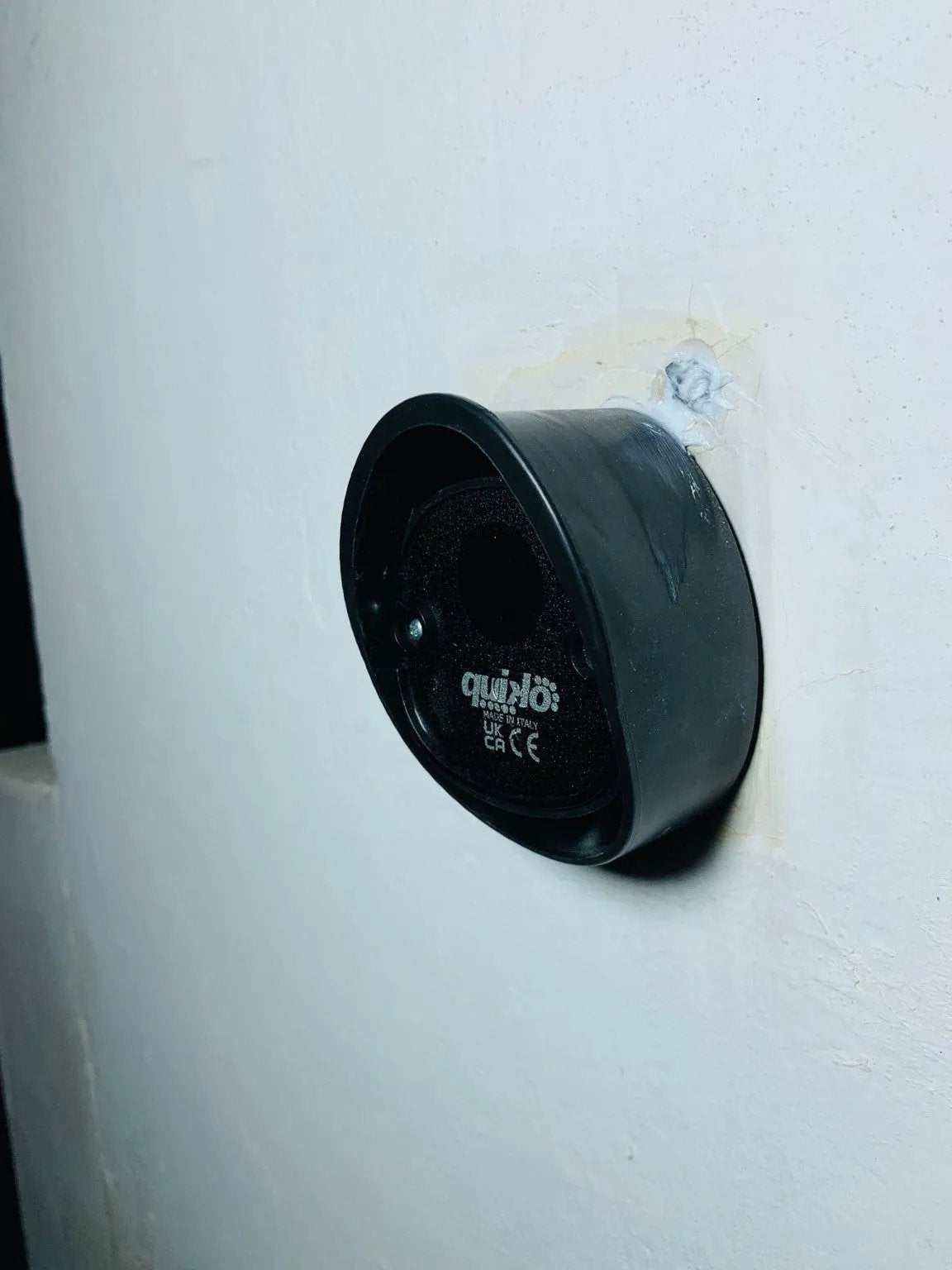 Quiko MOOVY sliding gate operator in Qatar, black rounded motor housing with a recessed circular control panel and logo