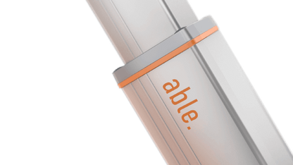 Able HY-Series Hydraulic Swing Gate Operators, silver metal hydraulic actuator with orange trim and Able branding