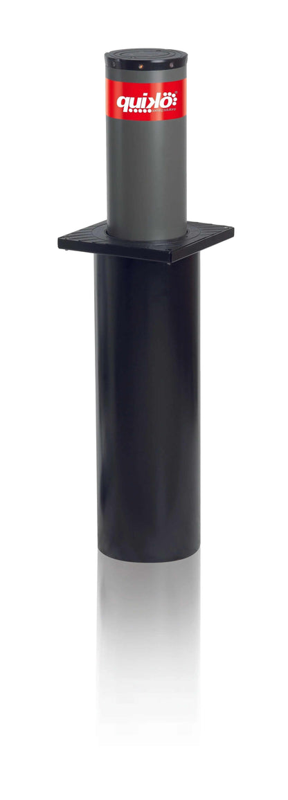 Quiko Automatic Rising Bollards, a dark grey and black cylindrical metal bollard with a red Quiko label and square mounting plate.