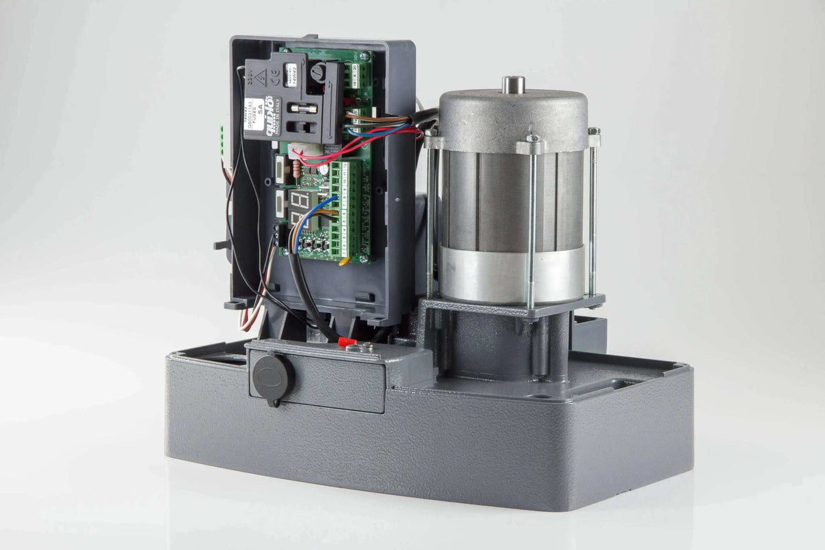 Quiko MOOVY Sliding Gate Operator with a grey metal base, exposed silver motor, and open control panel with wiring.