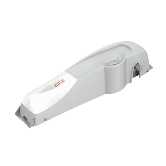 Garage door operator, Able DD Small 9000D 230, with a smooth white casing and compact elongated body.