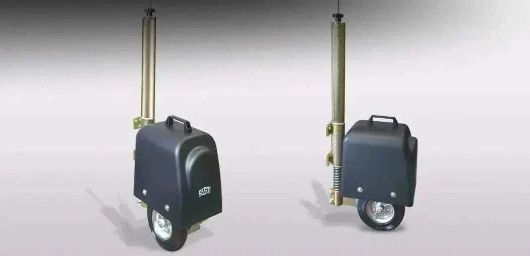 Swing gate wheel-drive operator, Casit ROLLY Wheel Drive, with a dark grey housing, metal mounting rod and small wheel.