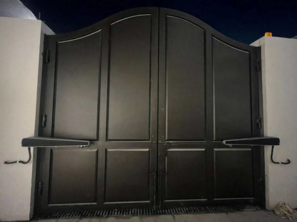 Comunello ABACUS 300 Swing Gate Motor shown on a dark grey double-leaf metal swing gate with arched panels and side arms