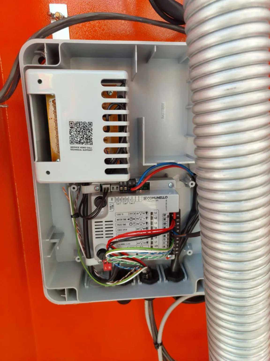 Comunello BORDER 400 Automatic Parking Barrier control box with a grey plastic housing, visible wiring and circuit board