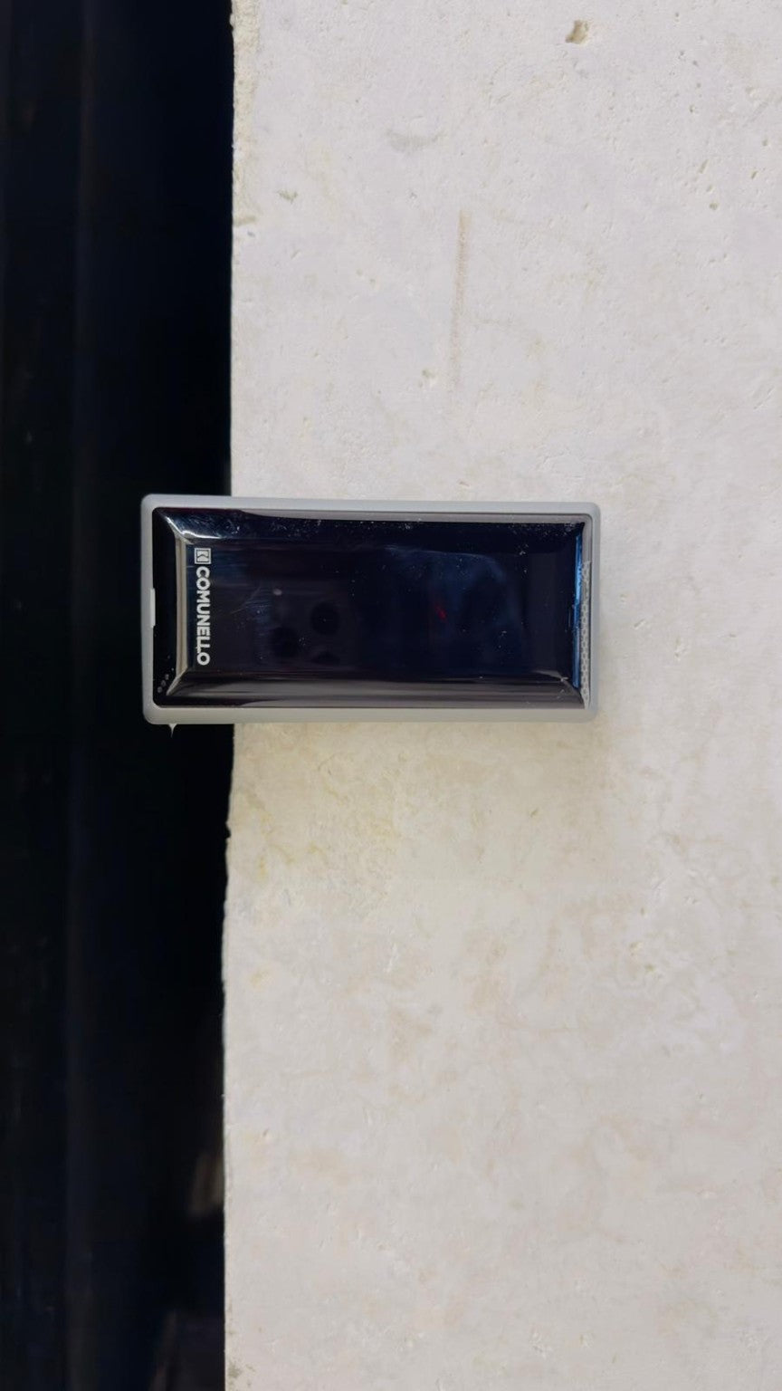 Comunello DART SLIM Gate Safety Photocells with a slim rectangular dark blue-black lens in a silver-gray casing, wall-mounted.