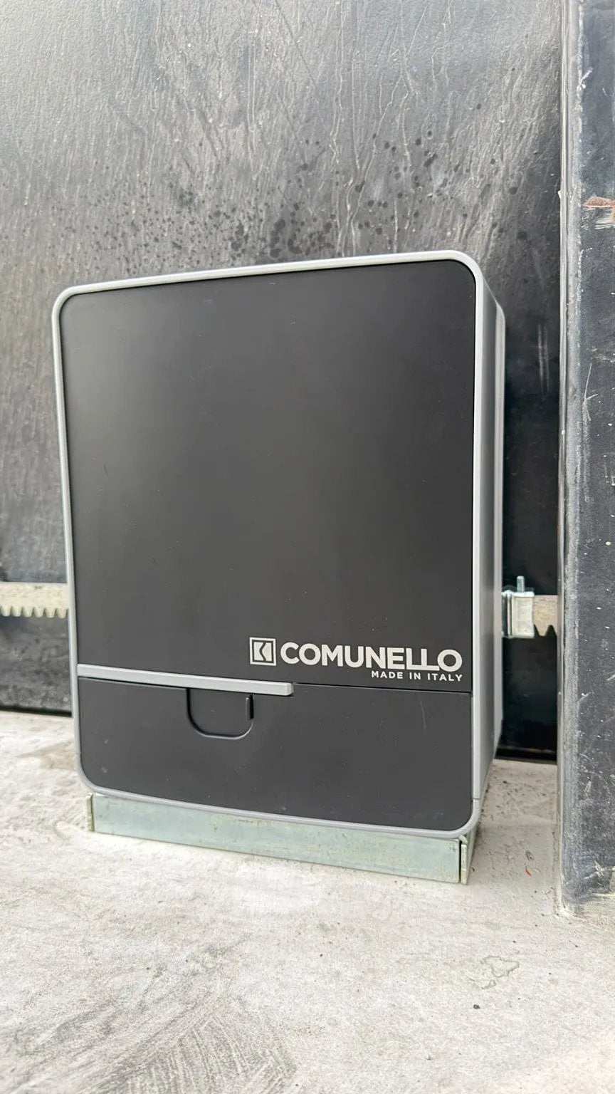 Comunello FORT 1500 Sliding Gate Motor with a dark grey casing, silver trim, front logo and visible gate rack