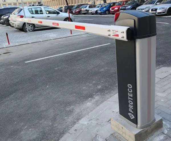 Proteco BARRY Automatic Road Barrier with a grey cabinet and white boom marked by red reflective panels