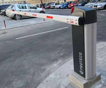 Proteco BARRY Automatic Road Barrier with a grey cabinet and white boom marked by red reflective panels