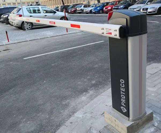 Proteco BARRY Automatic Road Barrier with a grey cabinet and white boom marked by red reflective panels