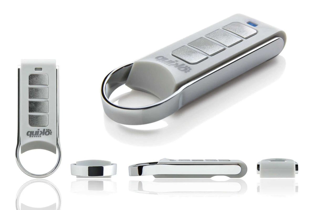 Quiko 4-Channel Gate Remote with a silver and white plastic body, four rectangular buttons and an oval keyring loop