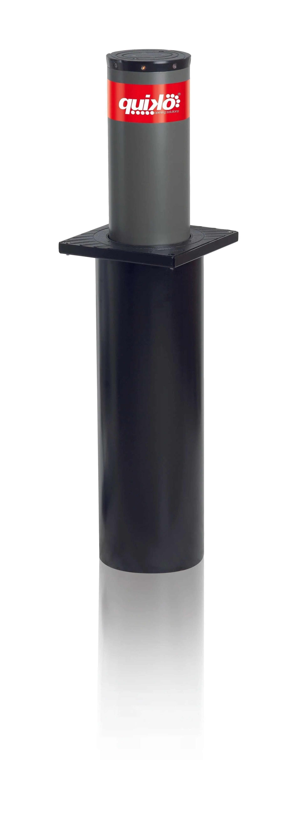 Quiko Automatic Rising Bollards, a dark grey and black cylindrical metal bollard with a red Quiko label and square mounting plate.