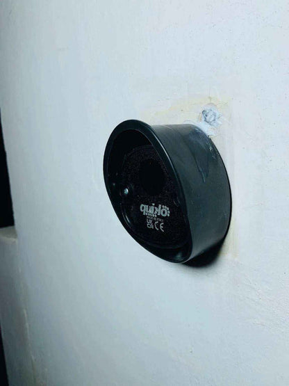 Quiko MOOVY sliding gate operator in Qatar, black rounded motor housing with a recessed circular control panel and logo