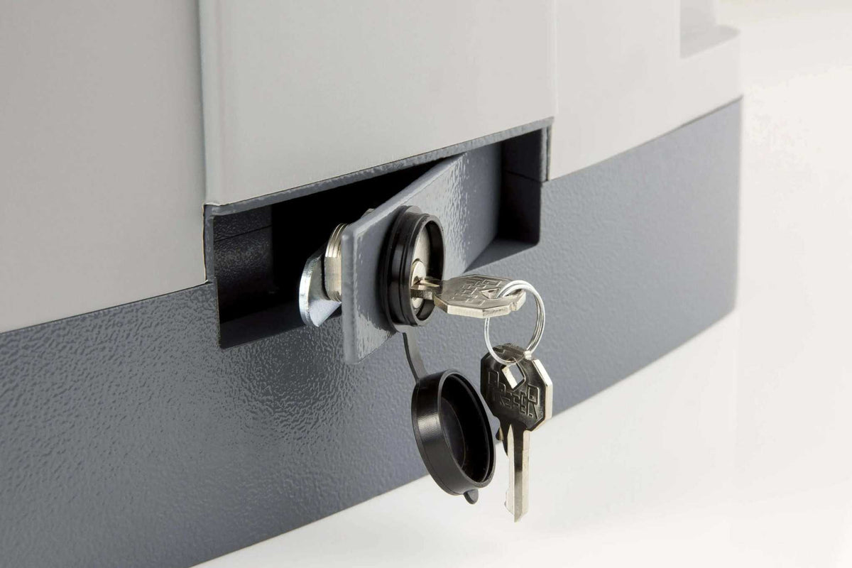 Quiko MOOVY sliding gate operator in Qatar with a gray metal housing, key lock cylinder, and hanging keys